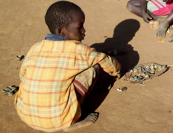 boy-with-bottlecaps.jpg